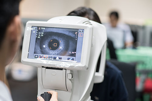 Doctor Administering an Eye Test